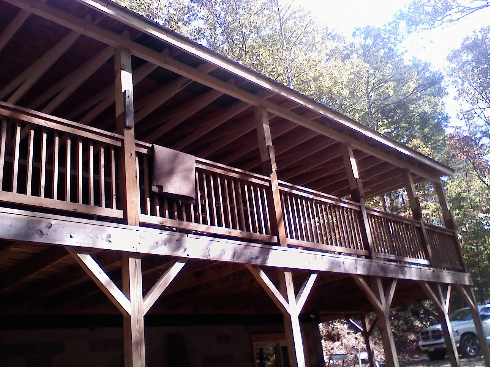 Timber framing under a new elevated porch and deck — Roof Leak Repair in Barneveld by Roofing Brothers
